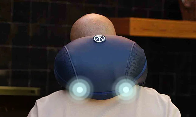 ThermNeck & Upper Back: Dual Theragun percussion on the upper back
