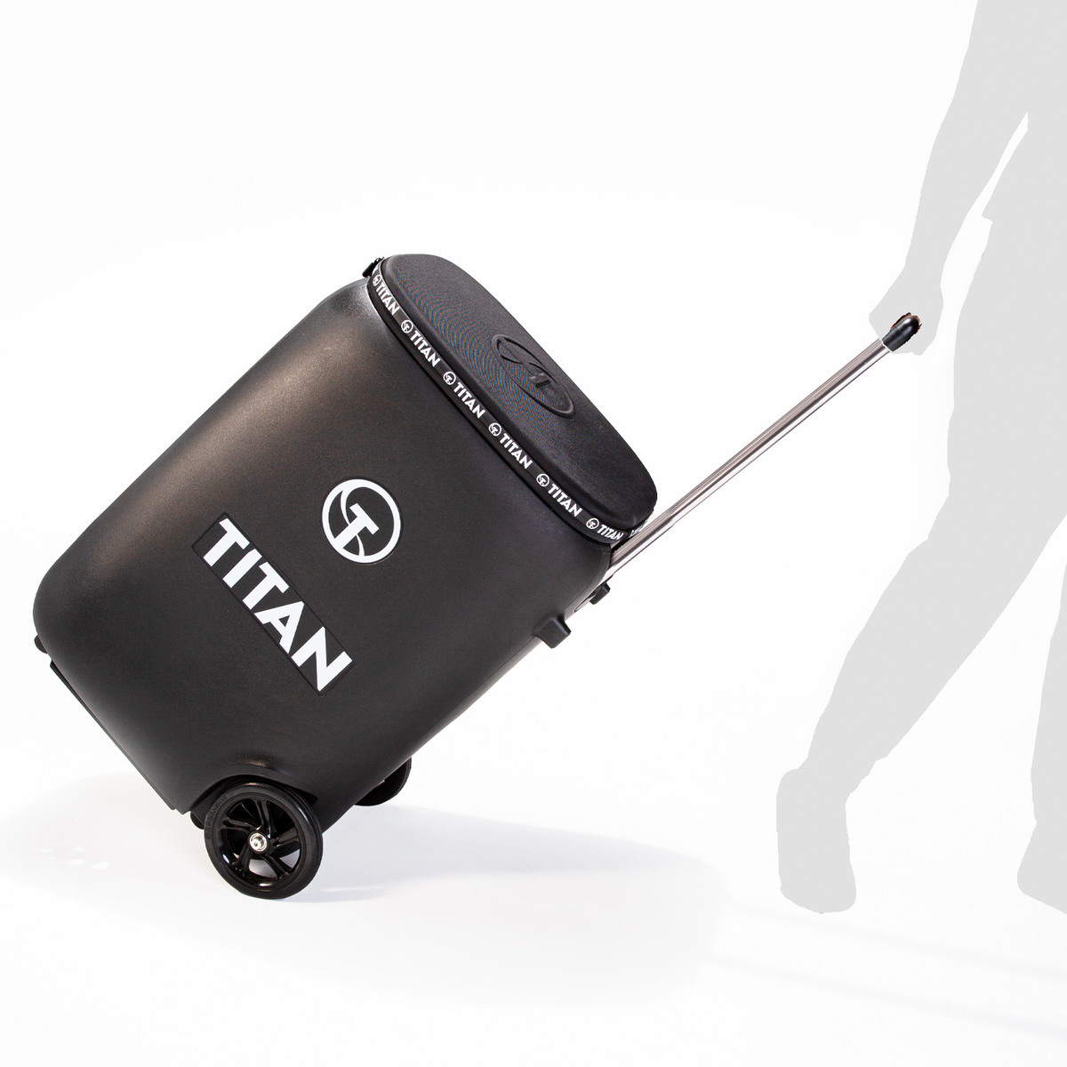 Titan ONE tennis ball machine tilted on its trolley wheels