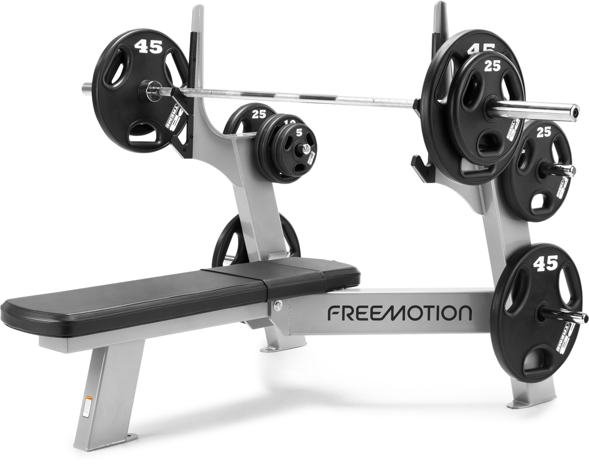 Olympic Flat Bench loaded with a barbell and plates (not included)