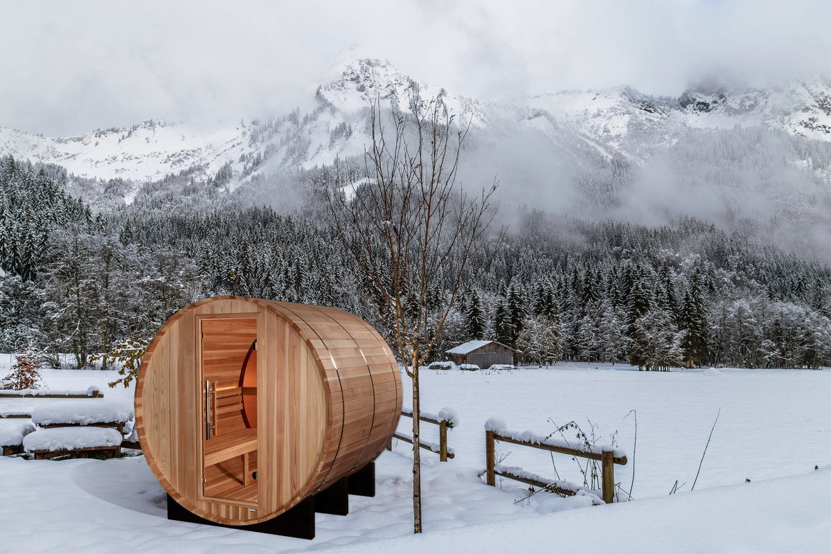Golden Designs Zurich 4-Person Traditional Barrel Sauna with Bronze Privacy View in a winter setting